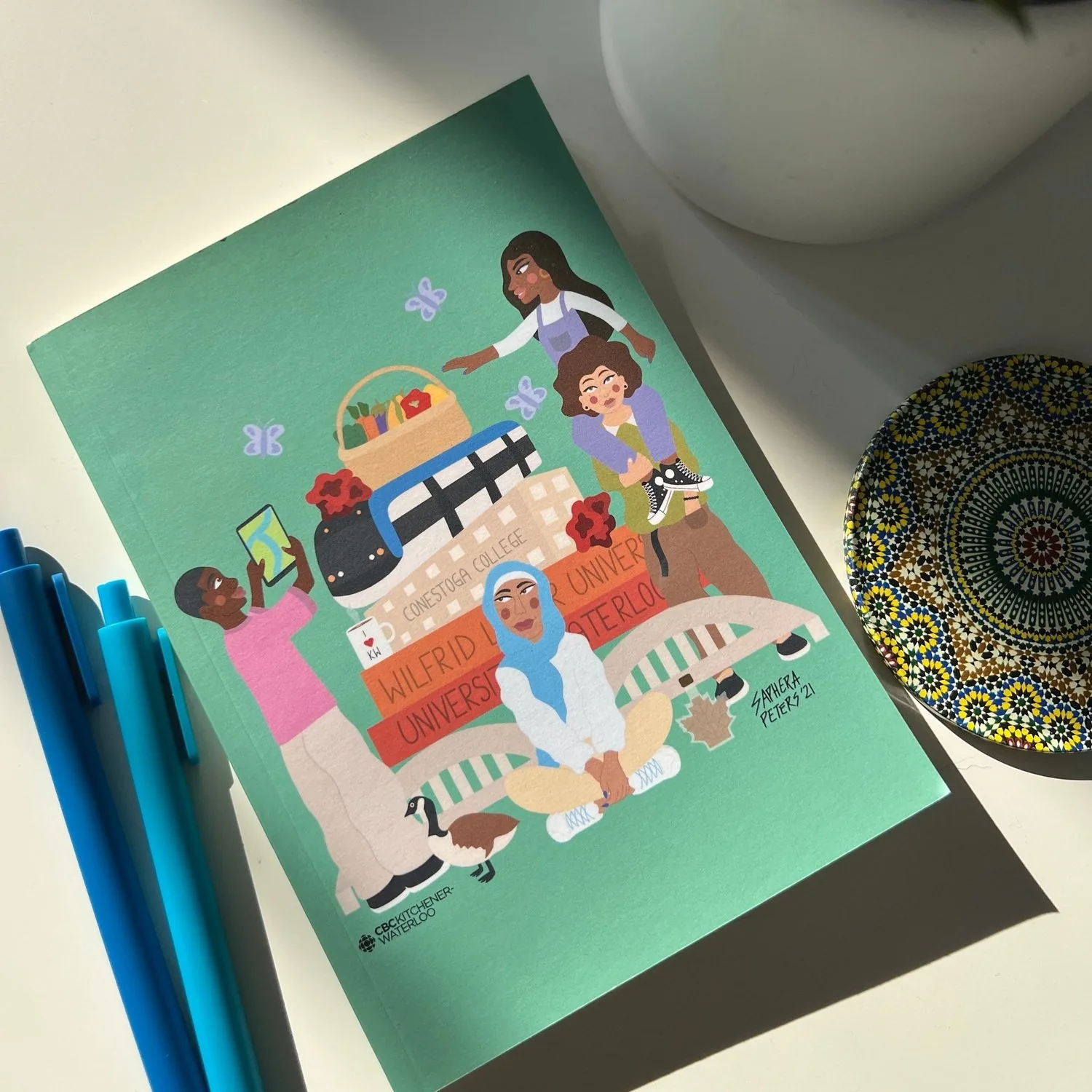 The design printed on notebooks for the community