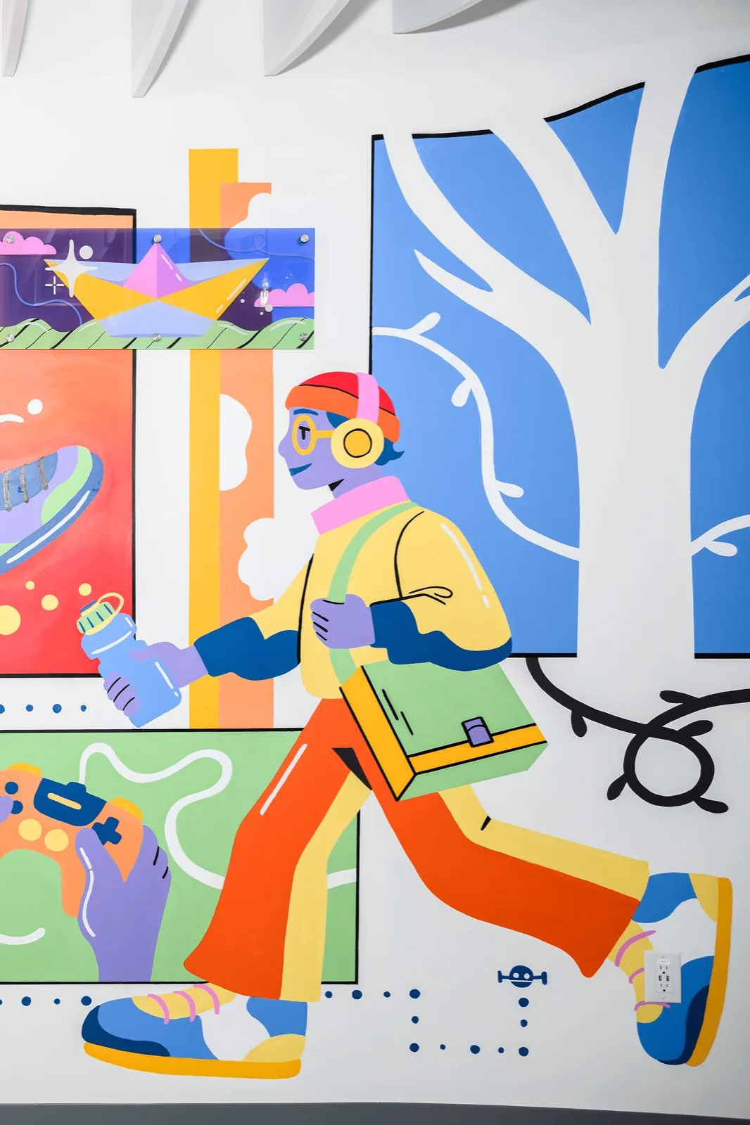 Mural detail showing youth gaming and painting
