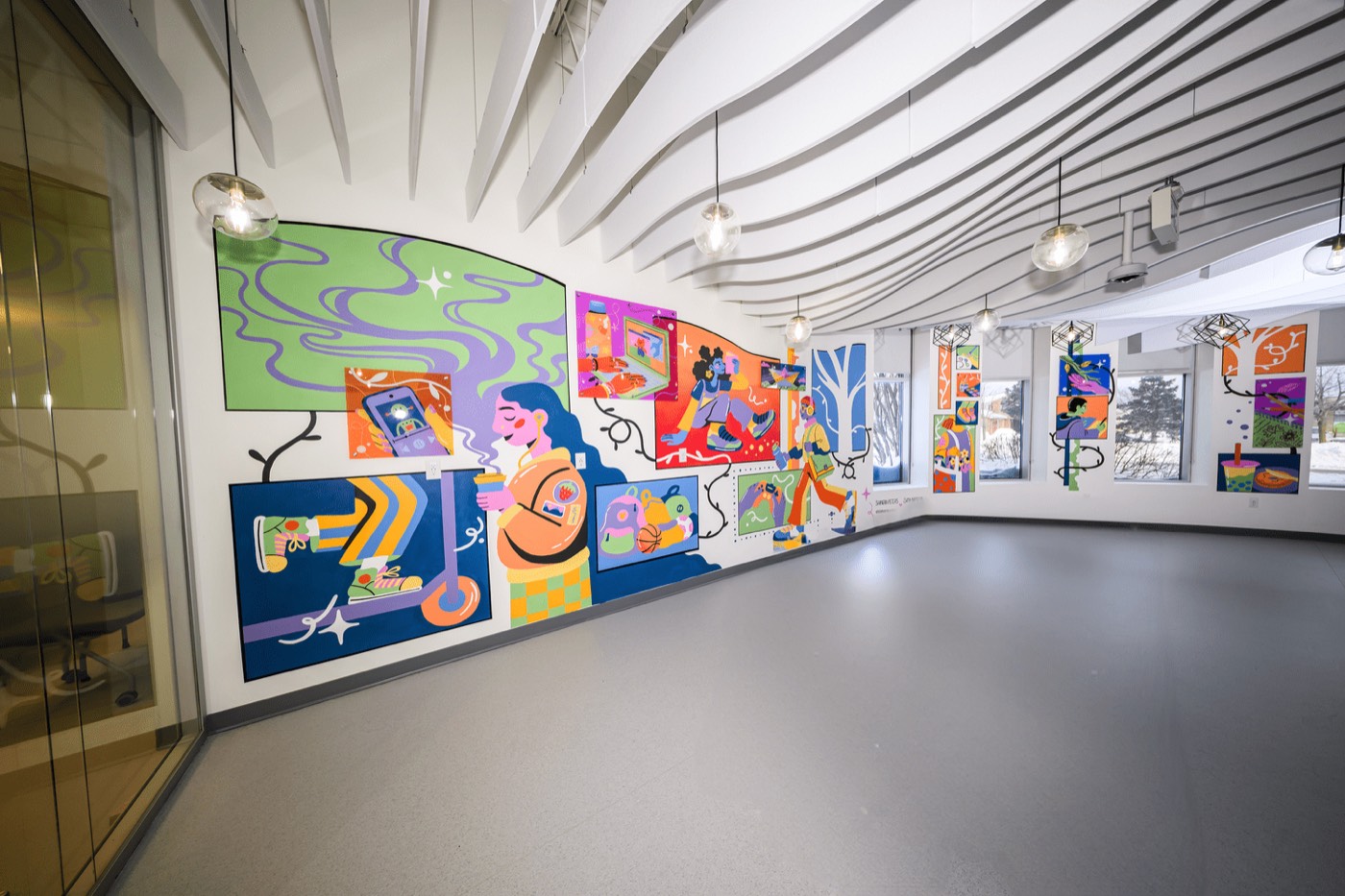 Guests exploring the mural at the unveiling event