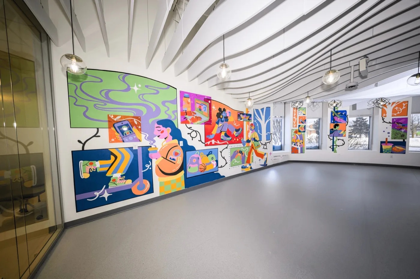 Guests exploring the mural at the unveiling event