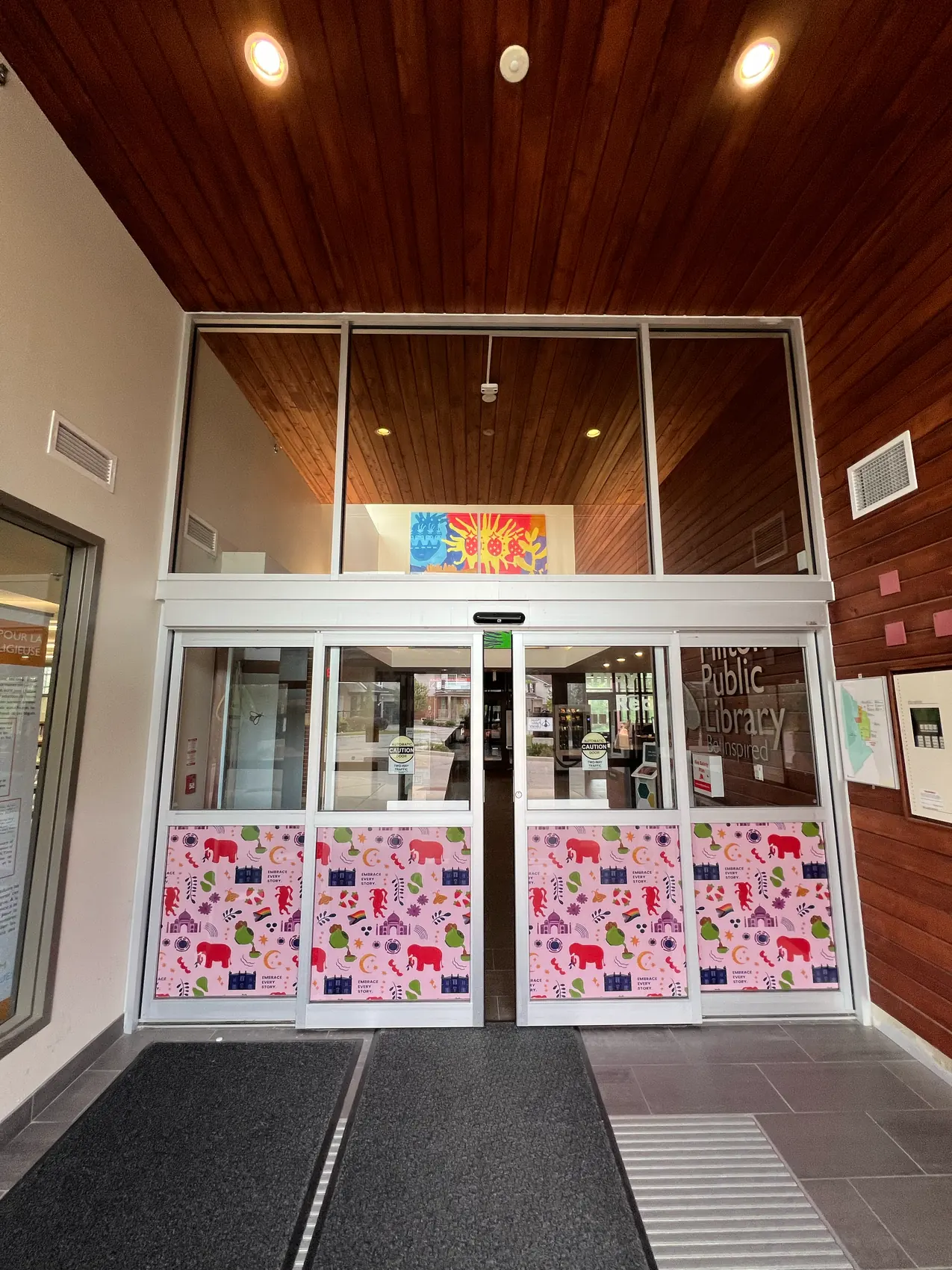 The Beaty branch entrance doors wrapped in the patterned vinyl