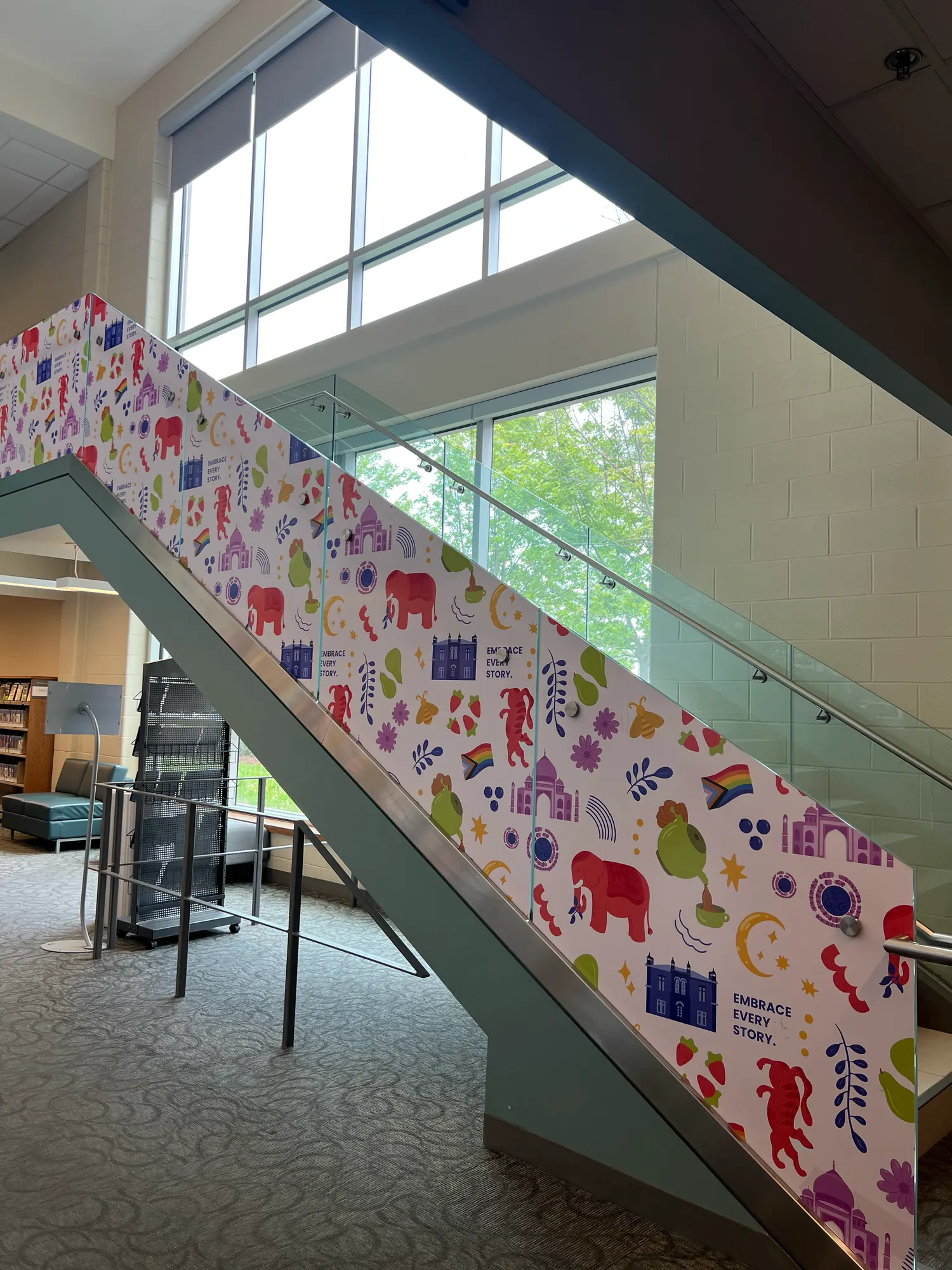 The patterned vinyl running along a staircase wall inside the Main branch