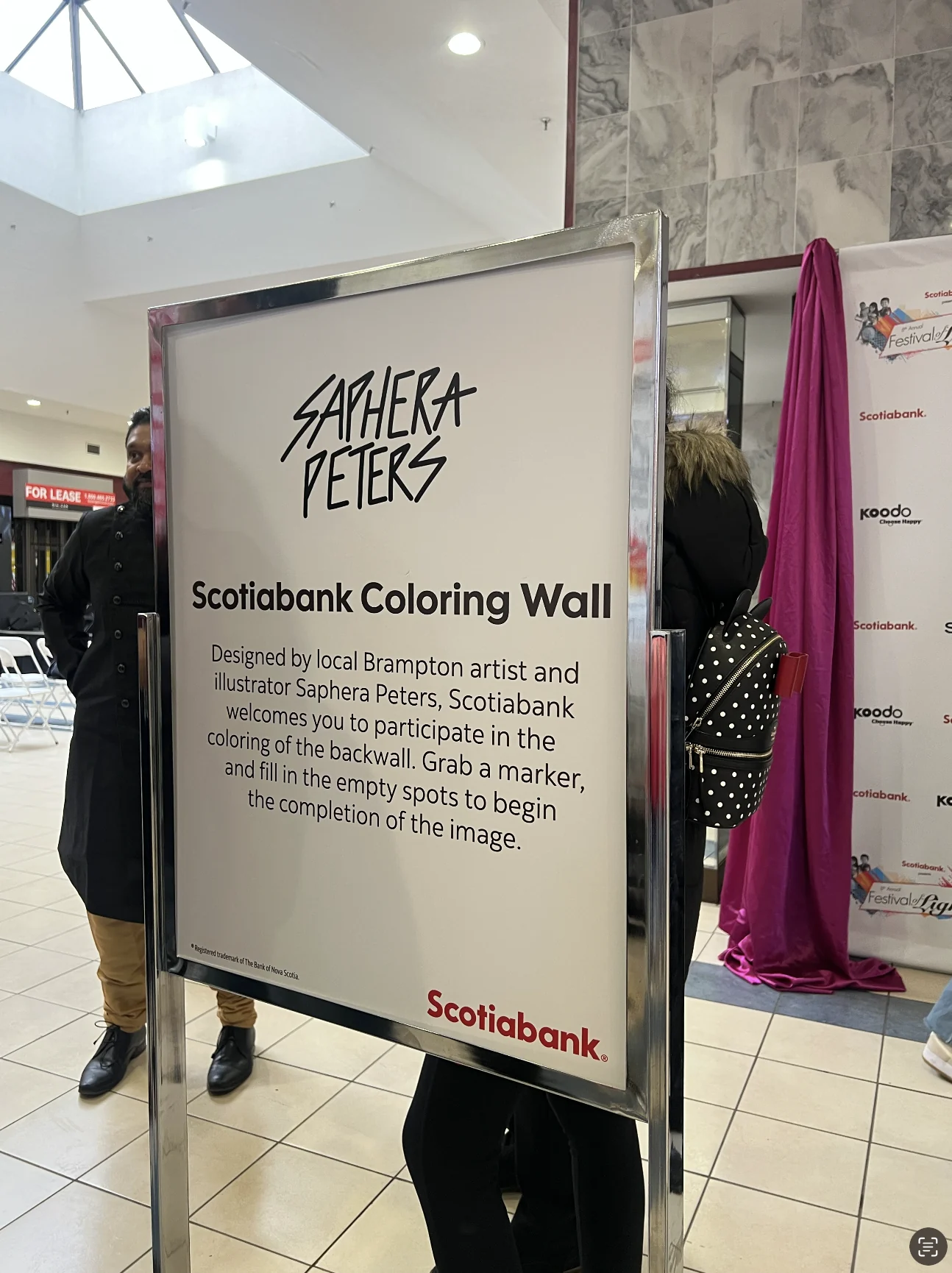 Event signage reading Scotiabank Colouring Wall, designed by local Brampton artist and illustrator Saphera Peters